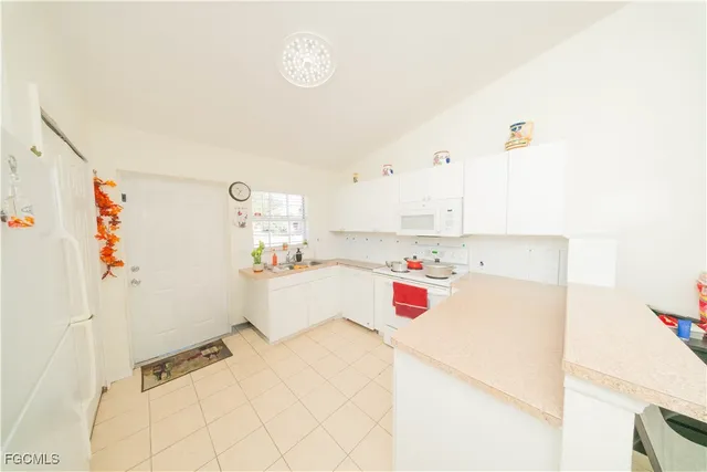 a bedroom with a bed and cabinets
