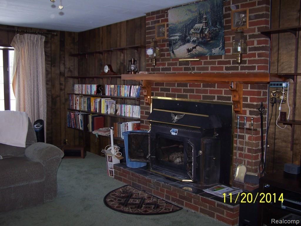 LIVING ROOM WITH WOOD BURNING INSERT