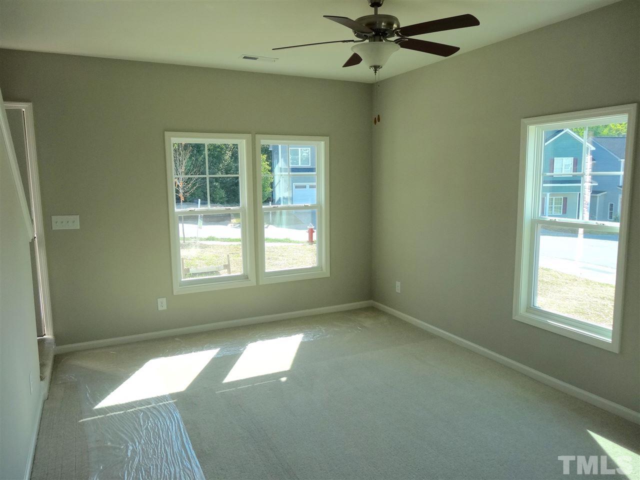 6832 Spanglers Spring Way Raleigh, NC 27610 - Photo 3 of 25 a view of an empty room with a window