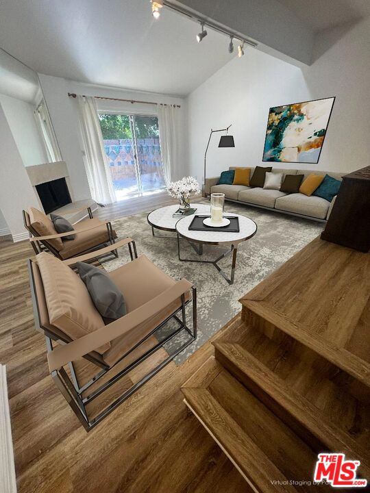 a living room with furniture and a table