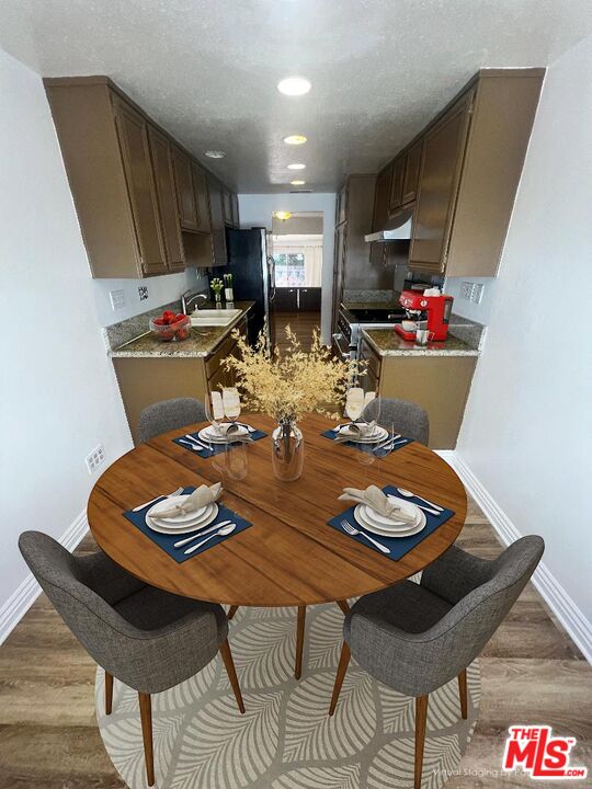 17153 Palisades Circle Pacific Palisades, CA 90272 - Photo 19 of 22 a view of a dining room with furniture