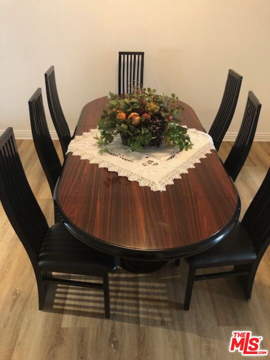 17153 Palisades Circle Pacific Palisades, CA 90272 - Photo 6 of 22 a bed sitting in a bedroom next to a lamp