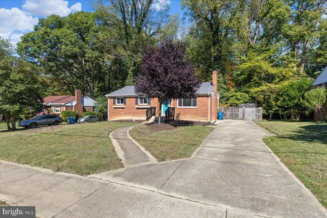 front view of a house with a yard