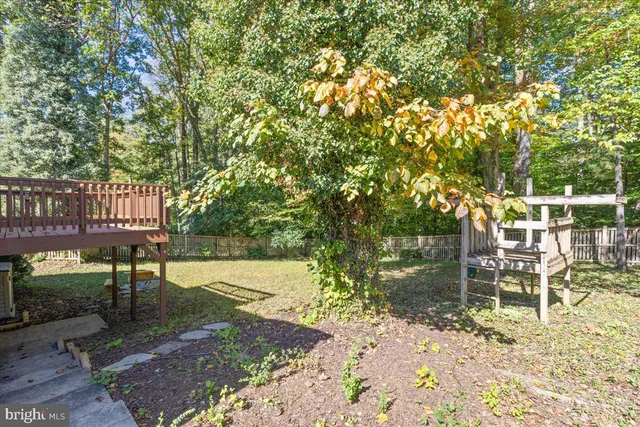 a view of a bench in a backyard