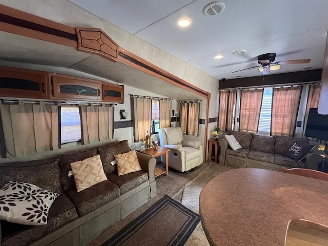 a kitchen with stainless steel appliances granite countertop sink stove top oven and cabinets