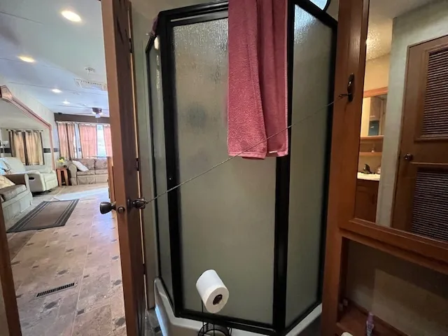 a living room with furniture a large window and a rug