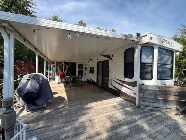a view of living room kitchen and entryway
