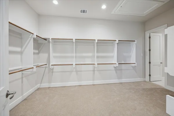 a view of an empty walk in closet