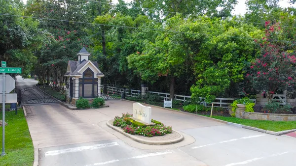 a view of a chair and table in backyard
