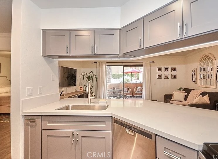 a kitchen with a sink and cabinets