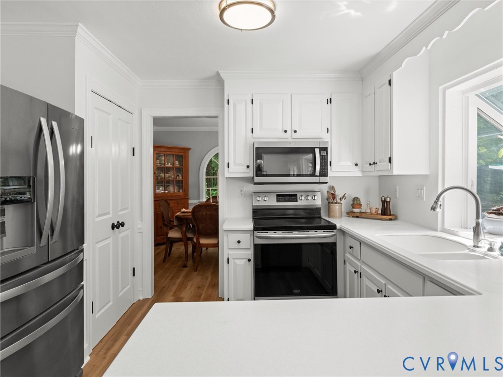 4013 Timber Ridge Road Midlothian, VA 23112 - Photo 4 of 71 Renovated kitchen with quartz countertops and stai