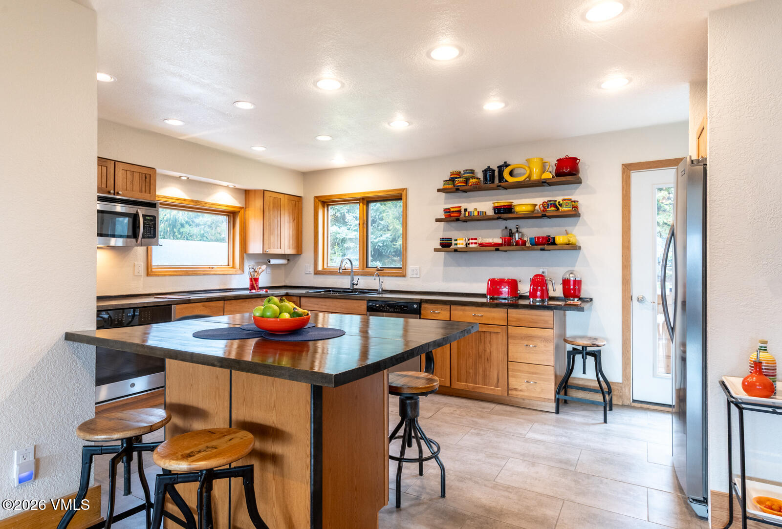 3016 Wildridge Road, Unit 6 Avon, CO 81620 - Photo 9 of 37 a kitchen with stainless steel appliances granite countertop a sink and a refrigerator
