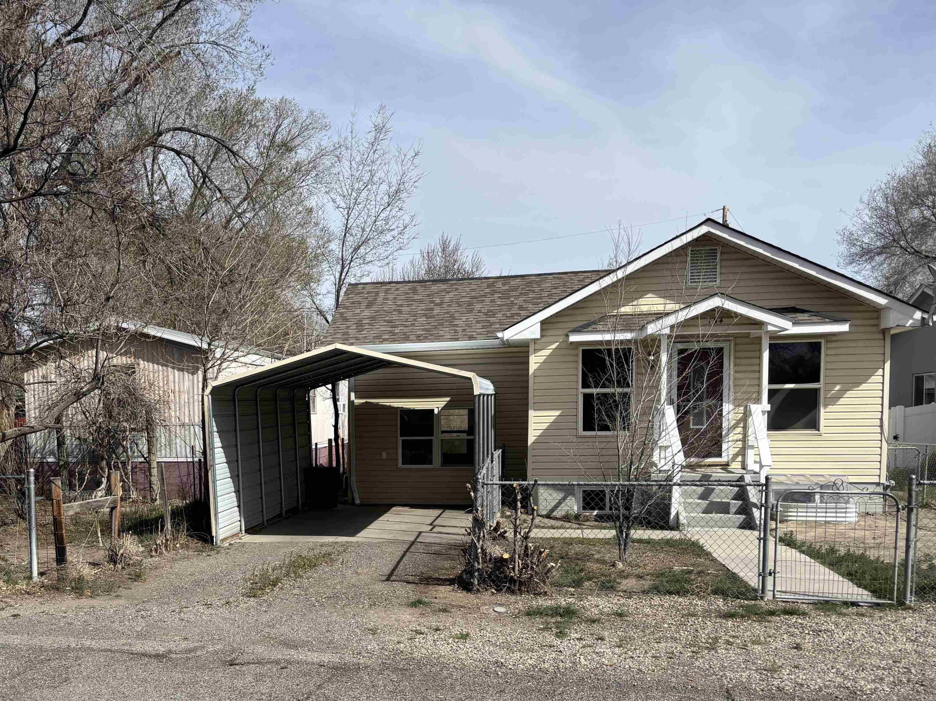 154 3rd Street Clifton, CO 81520 - Photo 1 of 14 a front view of a house with garden