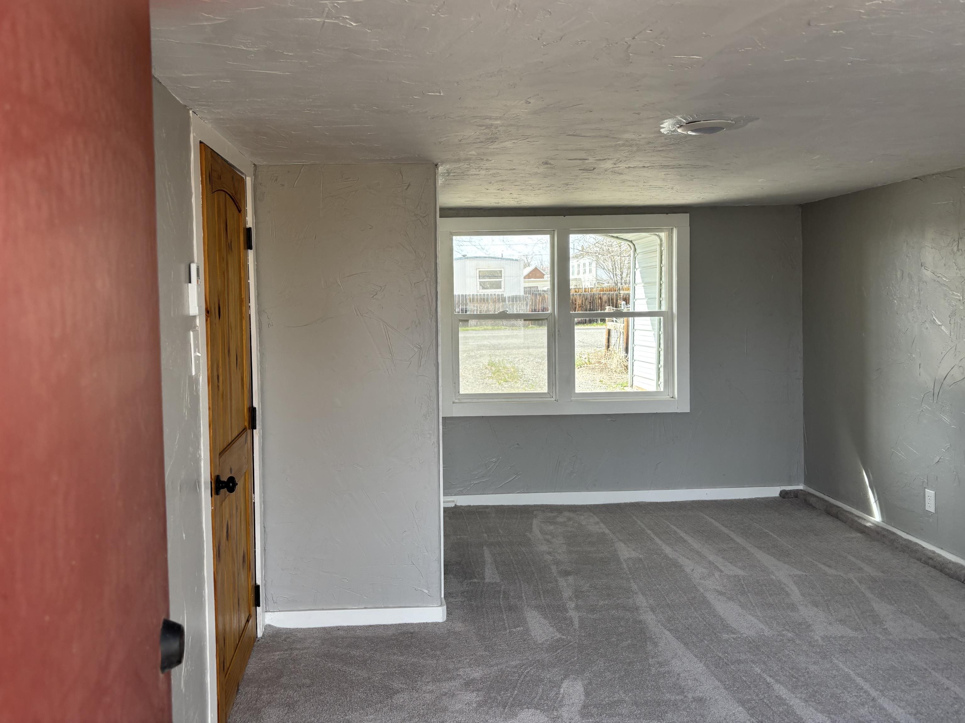 154 3rd Street Clifton, CO 81520 - Photo 11 of 14 an empty room with windows