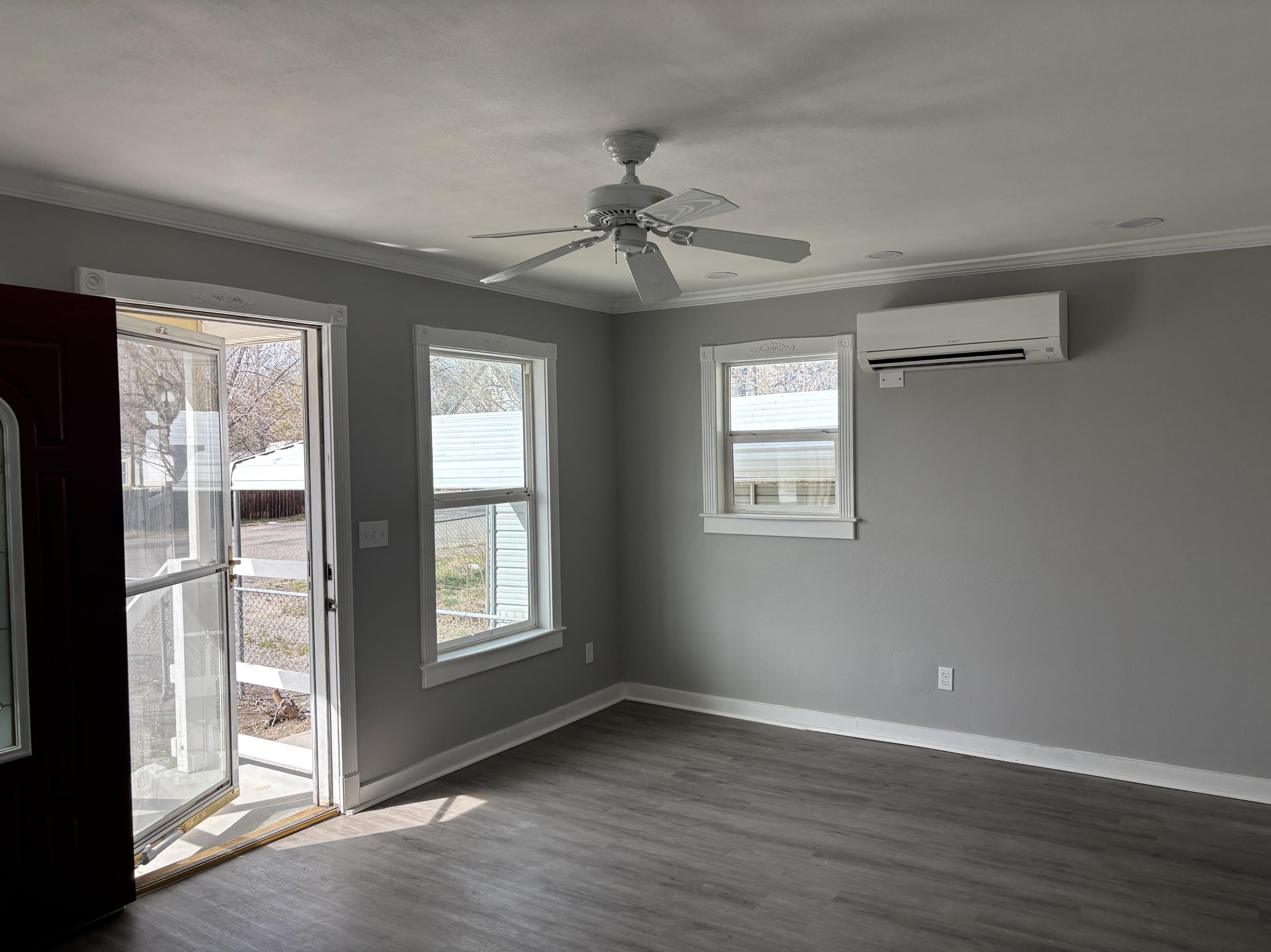 154 3rd Street Clifton, CO 81520 - Photo 2 of 14 a view of an empty room with window and wooden floor