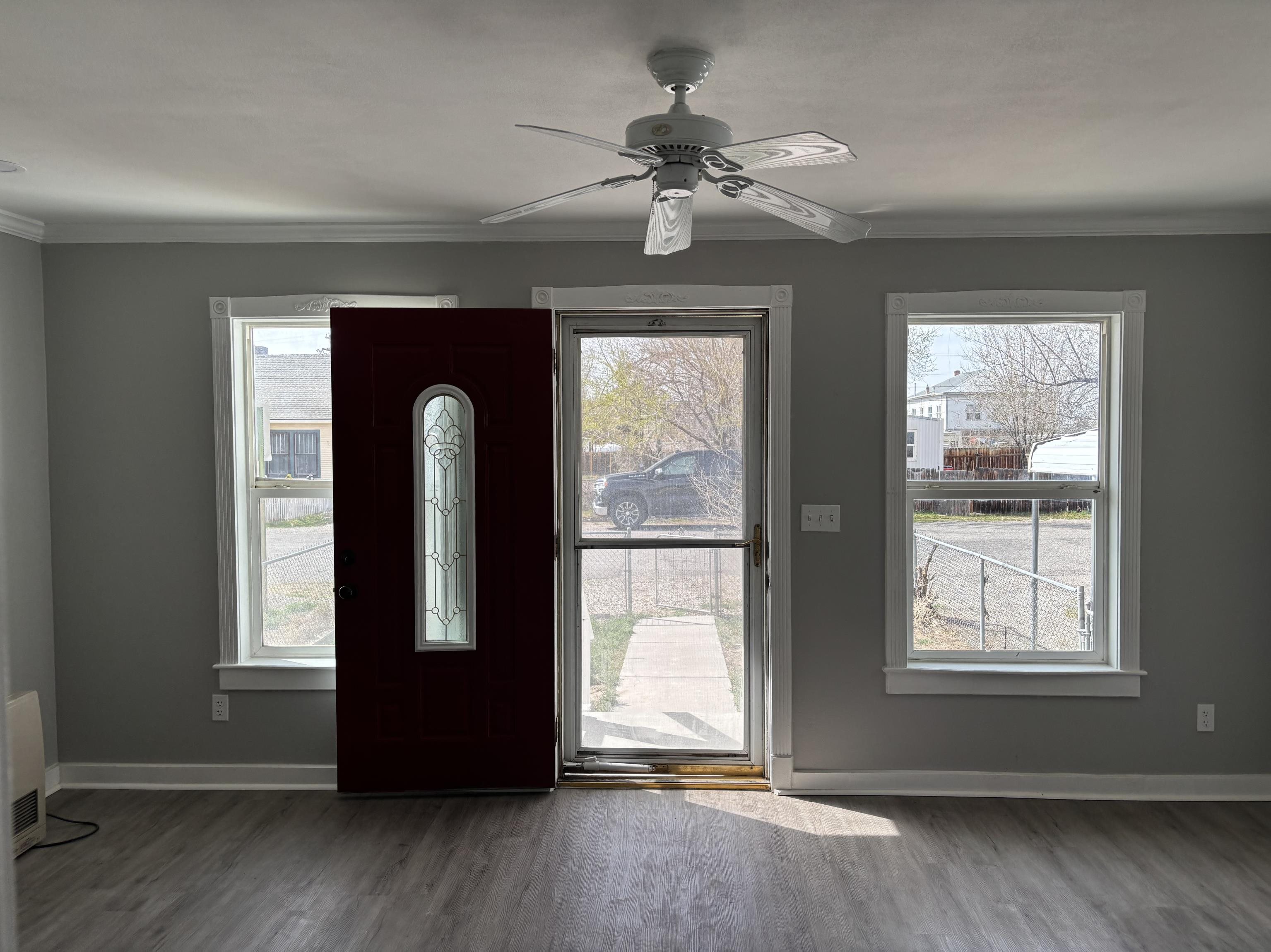 154 3rd Street Clifton, CO 81520 - Photo 3 of 14 a view of an empty room with wooden floor and a window