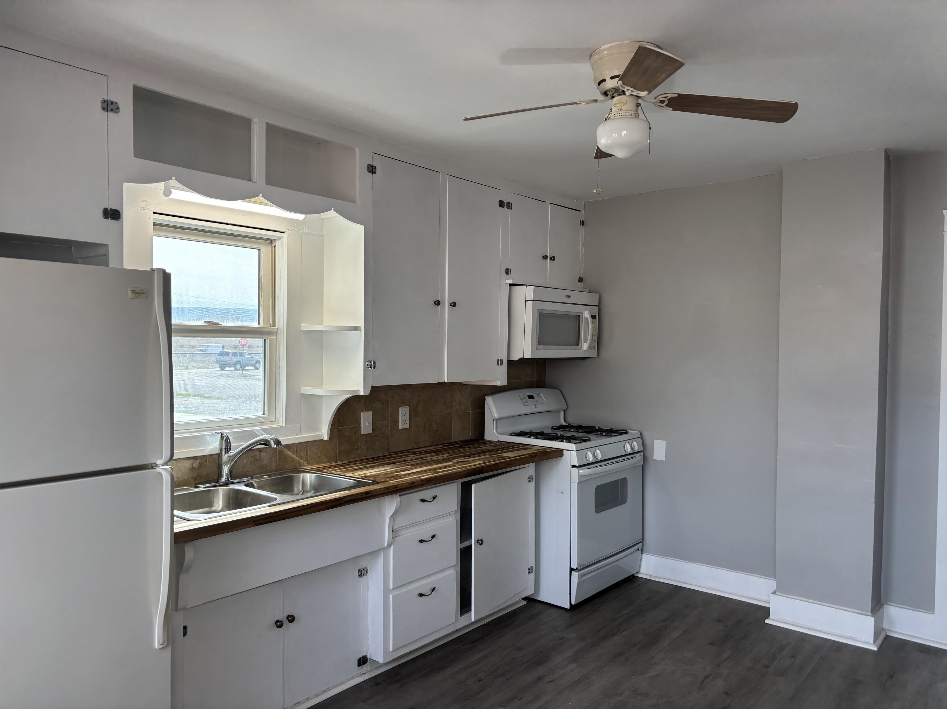 154 3rd Street Clifton, CO 81520 - Photo 4 of 14 a kitchen with stainless steel appliances granite countertop a sink stove and refrigerator