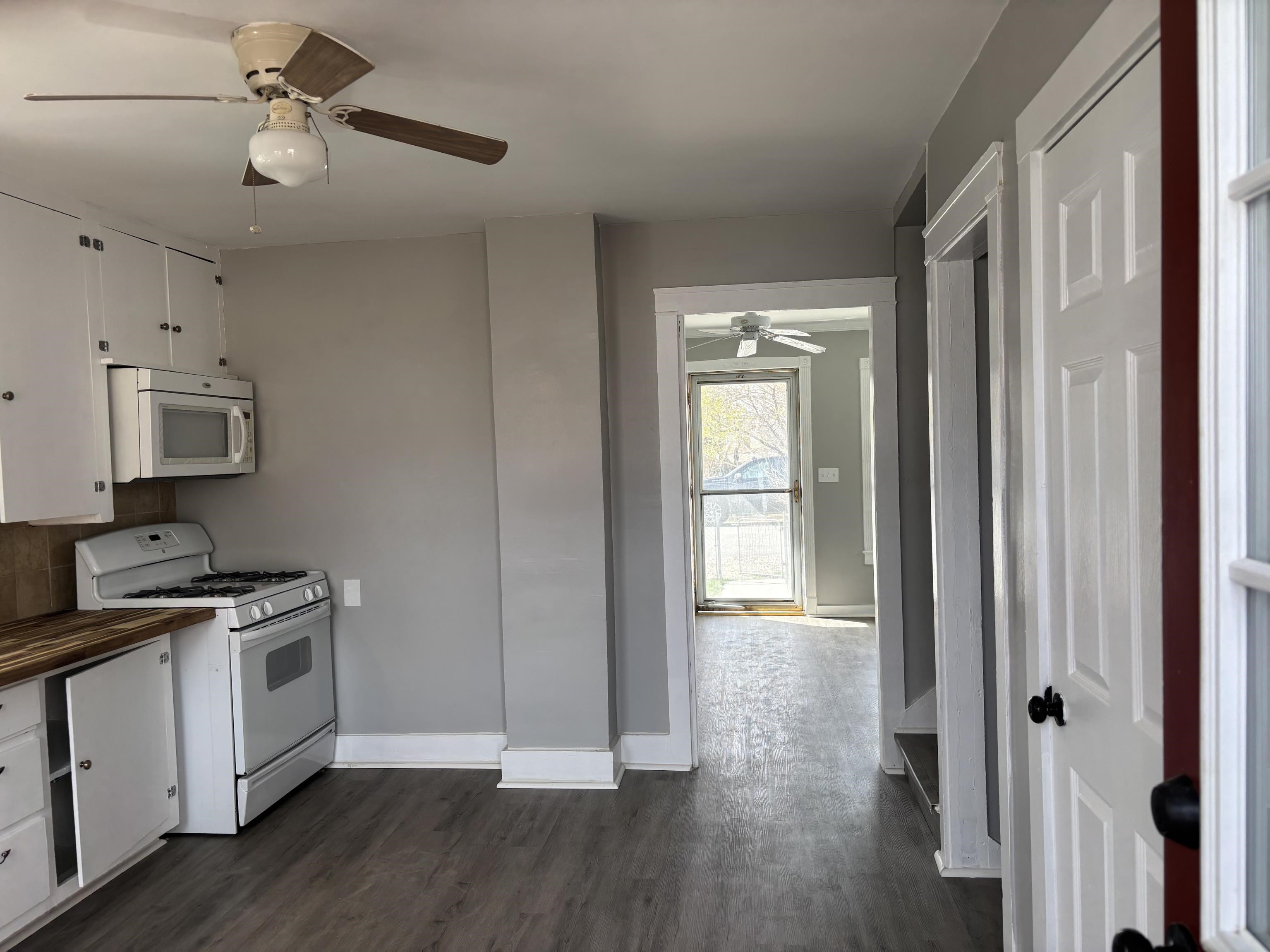 154 3rd Street Clifton, CO 81520 - Photo 5 of 14 a view of a kitchen with a stove cabinets and wooden floor