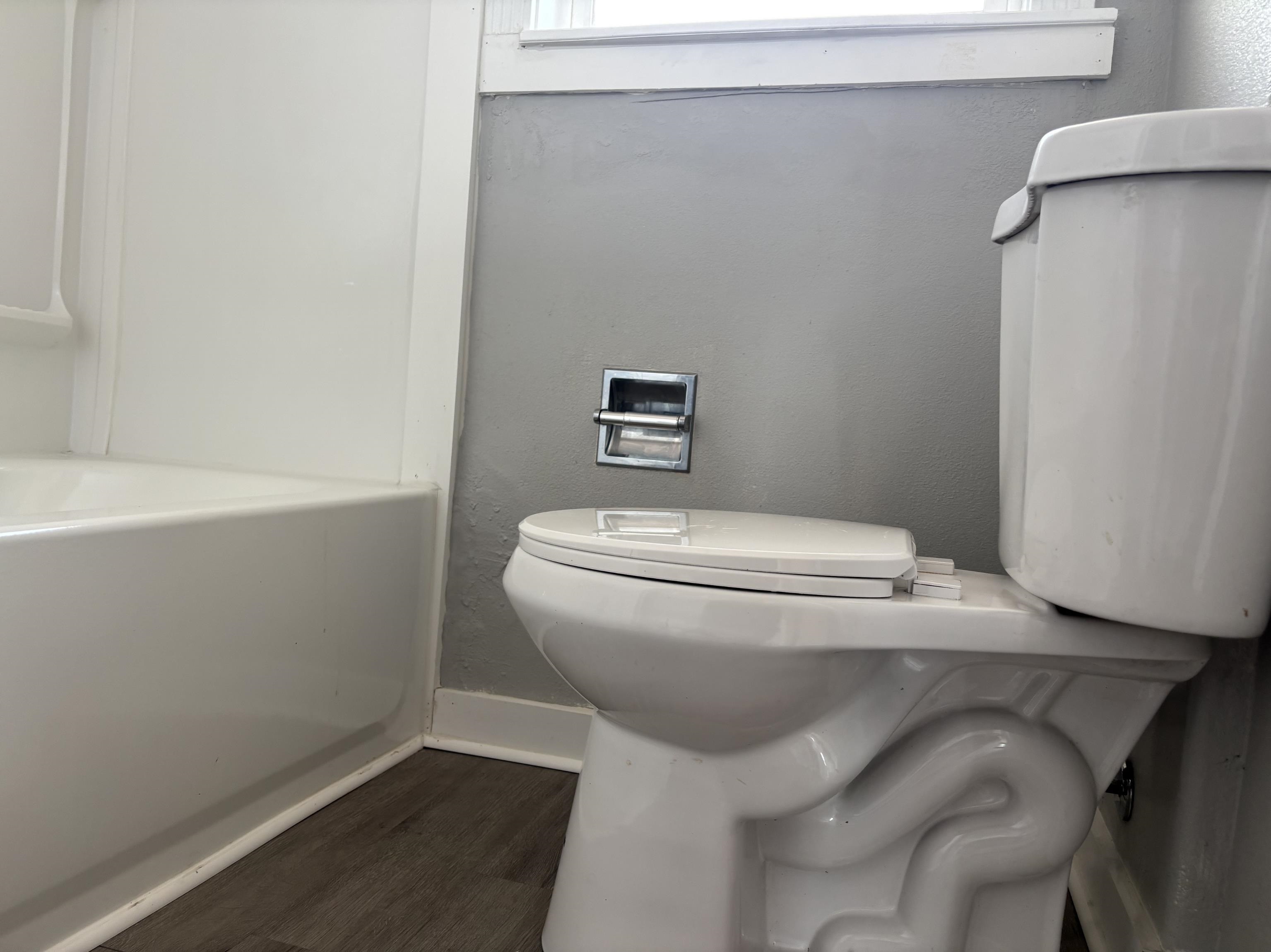 154 3rd Street Clifton, CO 81520 - Photo 7 of 14 a white toilet sitting next to a white sink
