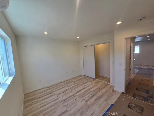 en empty room with wooden floor