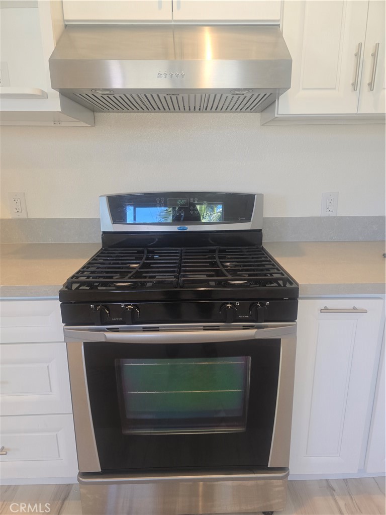 3374-unit A 3374-unit A Fashion Long Beach, CA 90810 - Photo 3 of 16 a stove top oven sitting inside of a kitchen