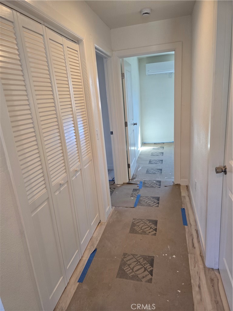 3374-unit A 3374-unit A Fashion Long Beach, CA 90810 - Photo 4 of 16 a view of a hallway with furniture and floor to ceiling window