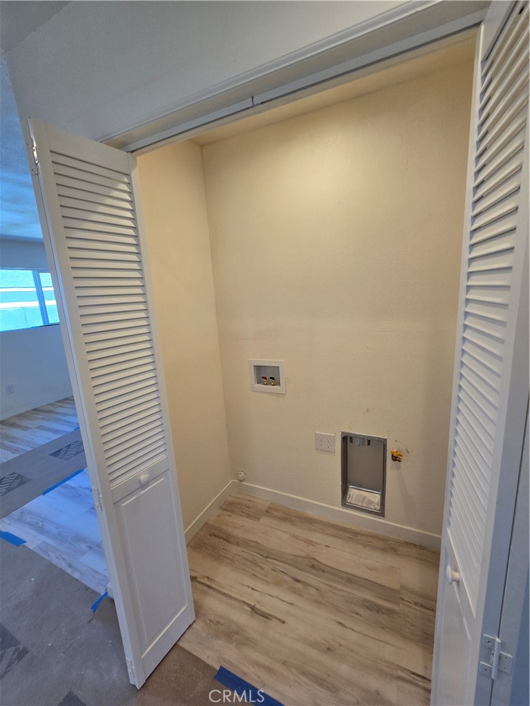 3374-unit A 3374-unit A Fashion Long Beach, CA 90810 - Photo 6 of 16 a view of a room with wooden floor and a window
