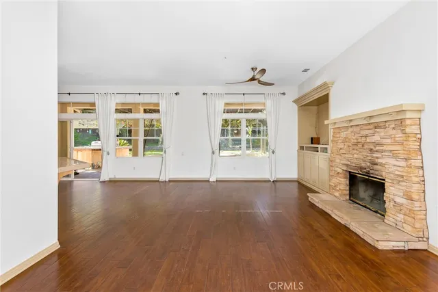a view of a livingroom with wooden floor and closet