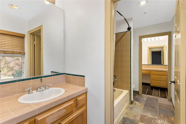 a view of a house with palm trees