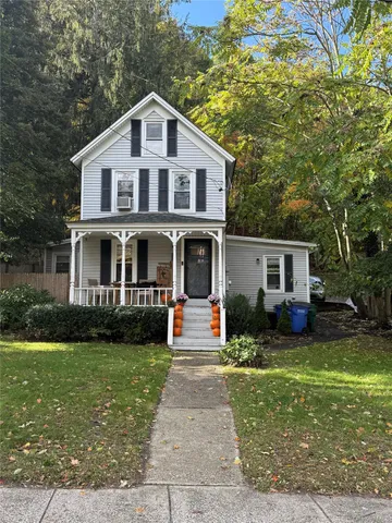 a front view of a house with garden