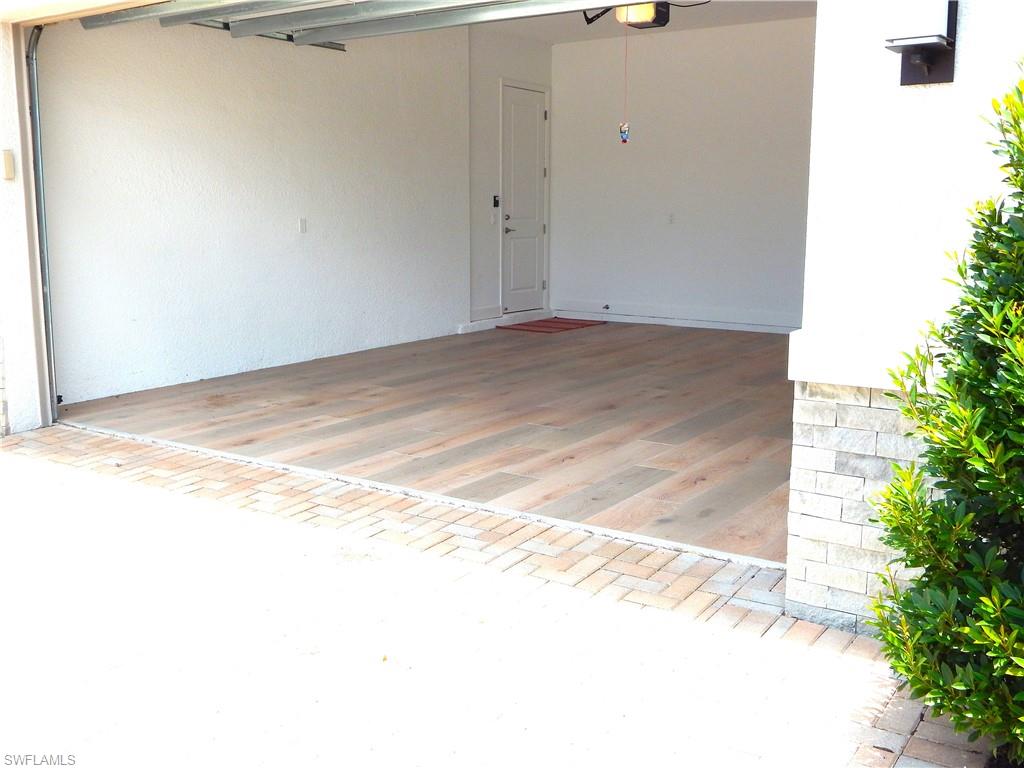 11331 Jacaranda Drive Naples, FL 34120 - Photo 13 of 47 Garage with a ceiling fan