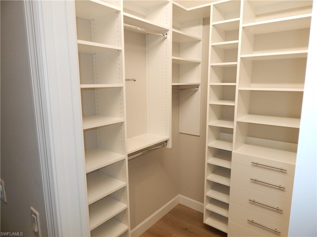 11331 Jacaranda Drive Naples, FL 34120 - Photo 25 of 47 Spacious closet with dark wood finished floors