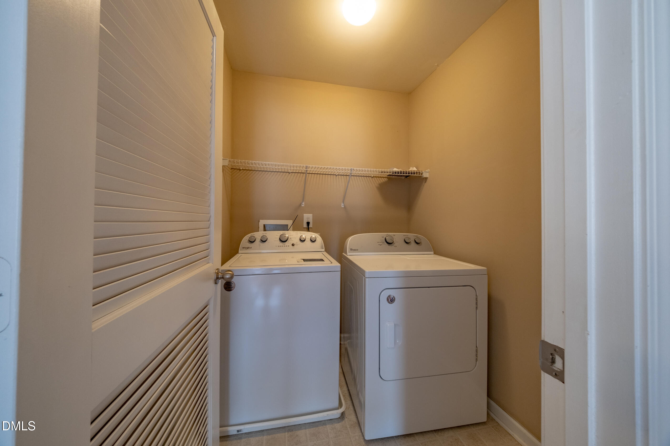 719 Obsidian Way Durham, NC 27703 - Photo 23 of 41 a utility room with dryer and washer