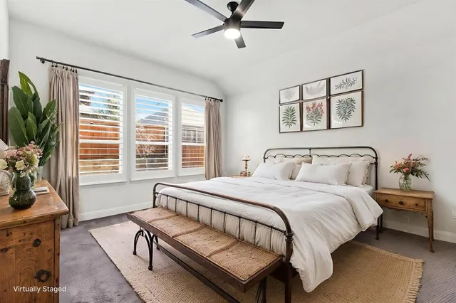 a bedroom with a bed and glass window