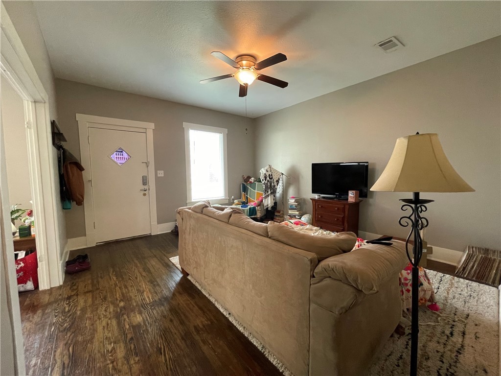 407 East Pease Street Bryan, TX 77803 - Photo 5 of 14 a living room with furniture and a flat screen tv