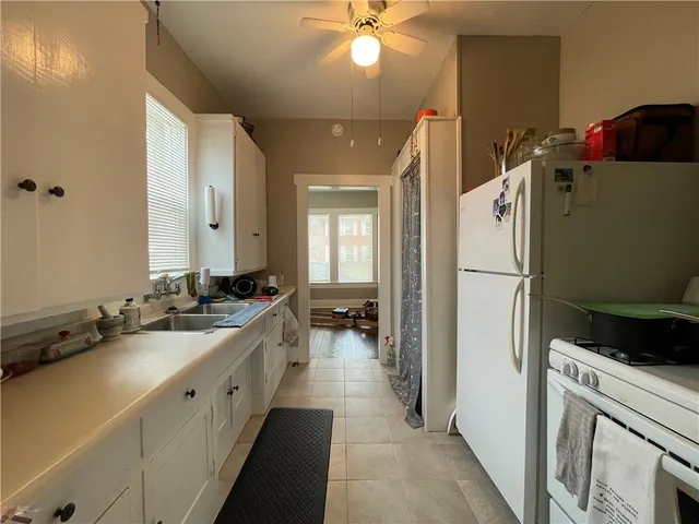 a bathroom with a sink a mirror and a shower