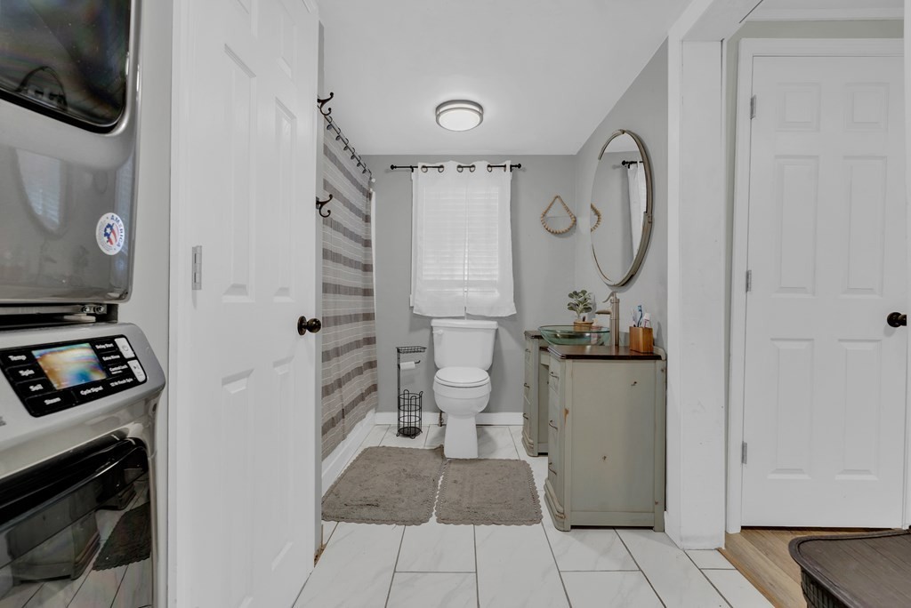 13593 Old Kentucky Road Walling, TN 38587 - Photo 11 of 30 a bathroom with a sink a toilet and shower