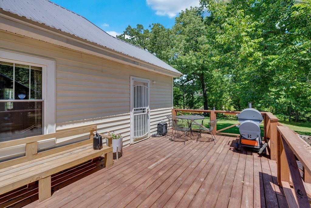 13593 Old Kentucky Road Walling, TN 38587 - Photo 18 of 30 a deck with wooden floor and fence