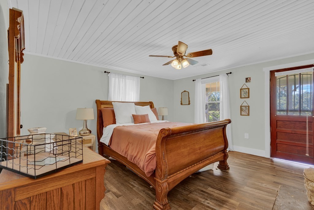 13593 Old Kentucky Road Walling, TN 38587 - Photo 10 of 30 a bed room with a bed and a chandelier