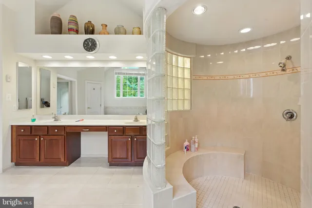 a white toilet sitting next to a bathroom sink