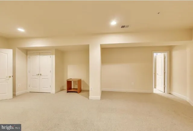 an empty room with closet area