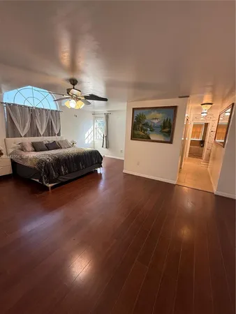 a bedroom with a bed and a table