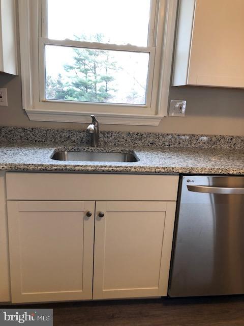 4355 Ridge Road Mount Airy, MD 21771 - Photo 9 of 54 a kitchen with granite countertop cabinets sink and window