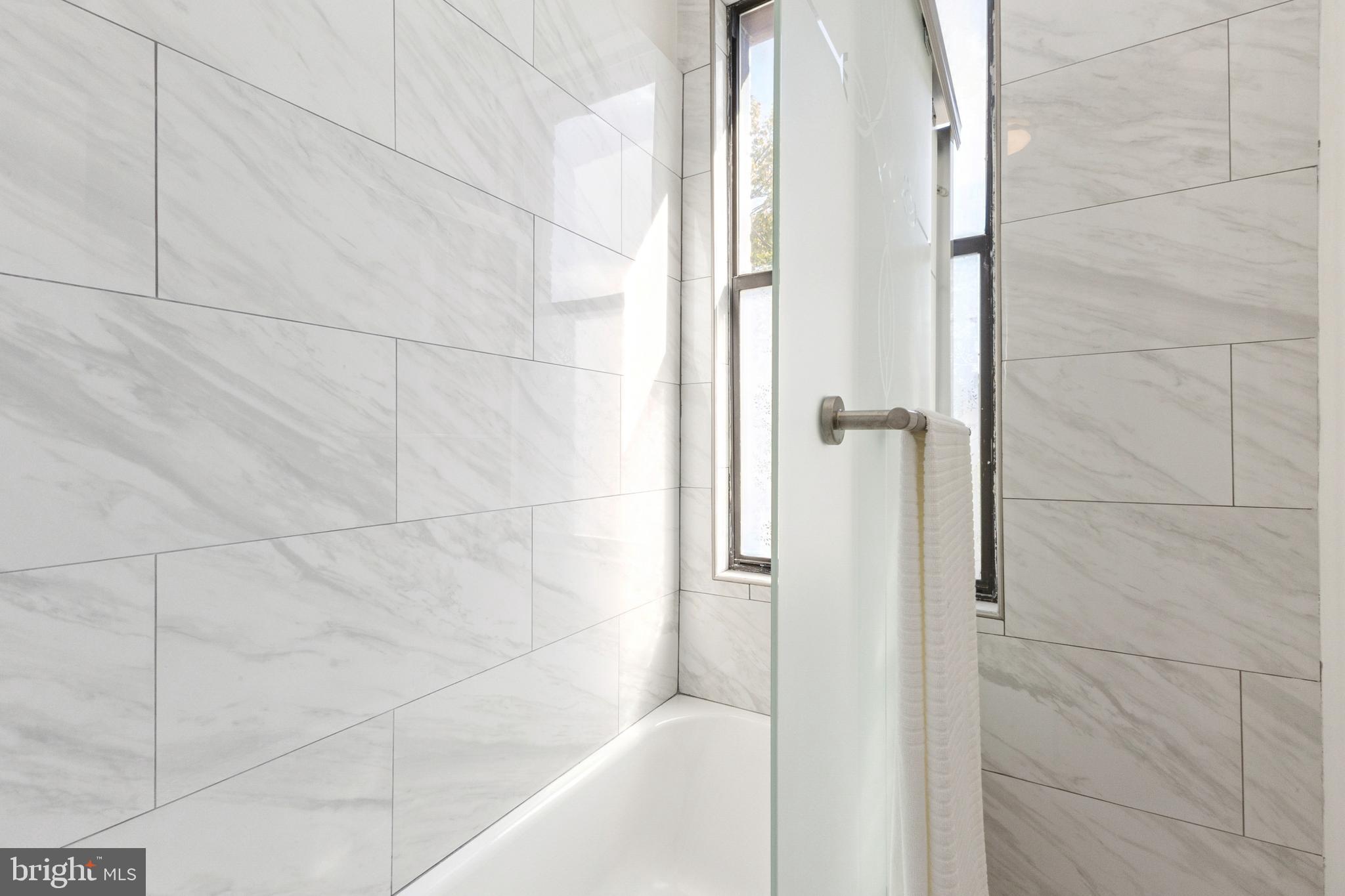 7 18th Street Southeast, Unit 208 Washington, DC 20003 - Photo 17 of 31 a bathroom with a bathtub