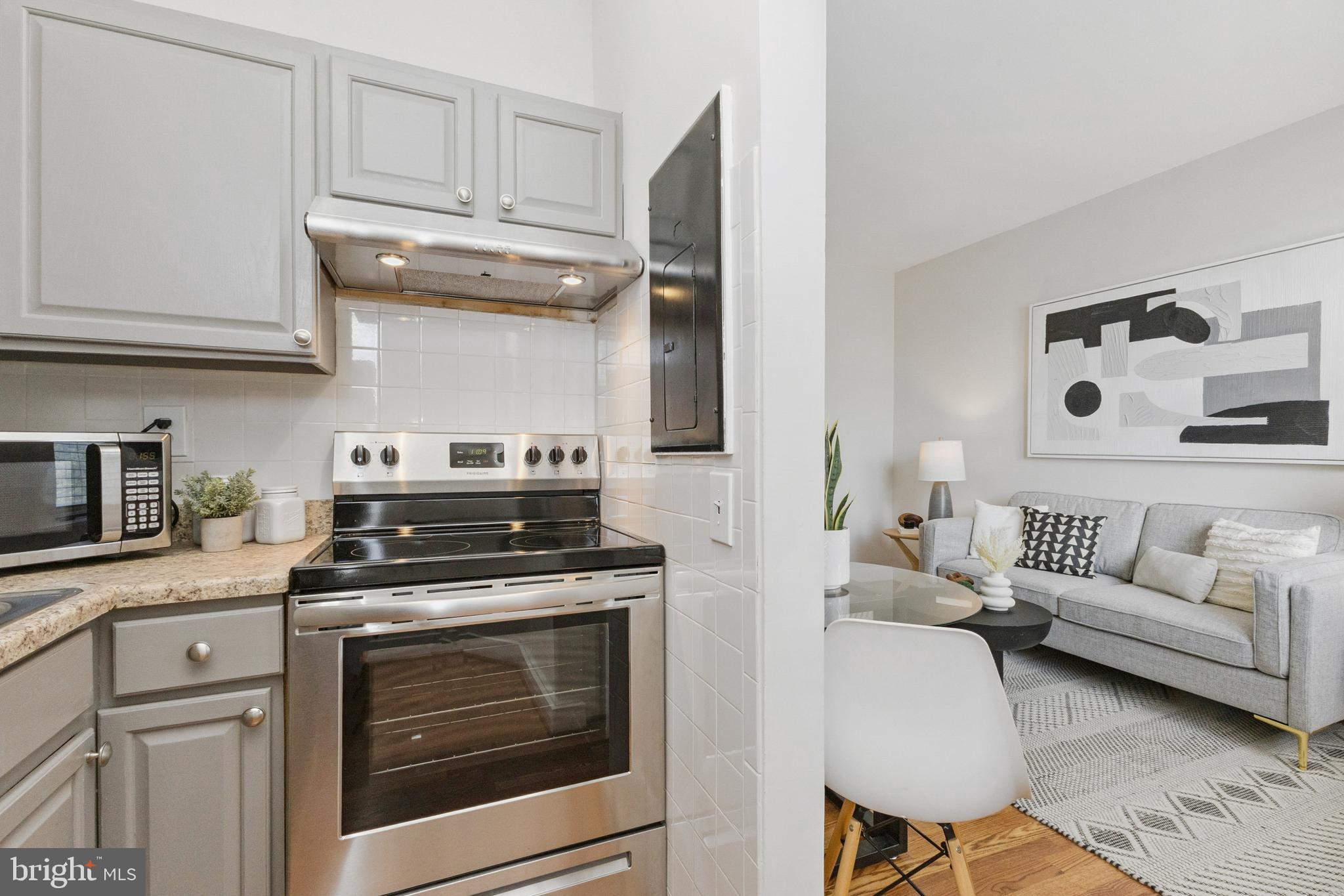 7 18th Street Southeast, Unit 208 Washington, DC 20003 - Photo 6 of 31 a kitchen with stainless steel appliances granite countertop a stove and a cabinets