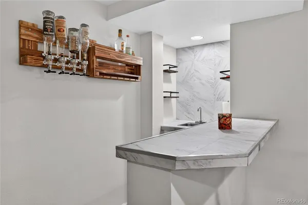 a kitchen with stainless steel appliances a sink and a refrigerator