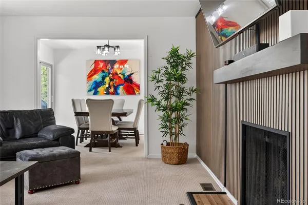 a view of living room filled with furniture and flower pot