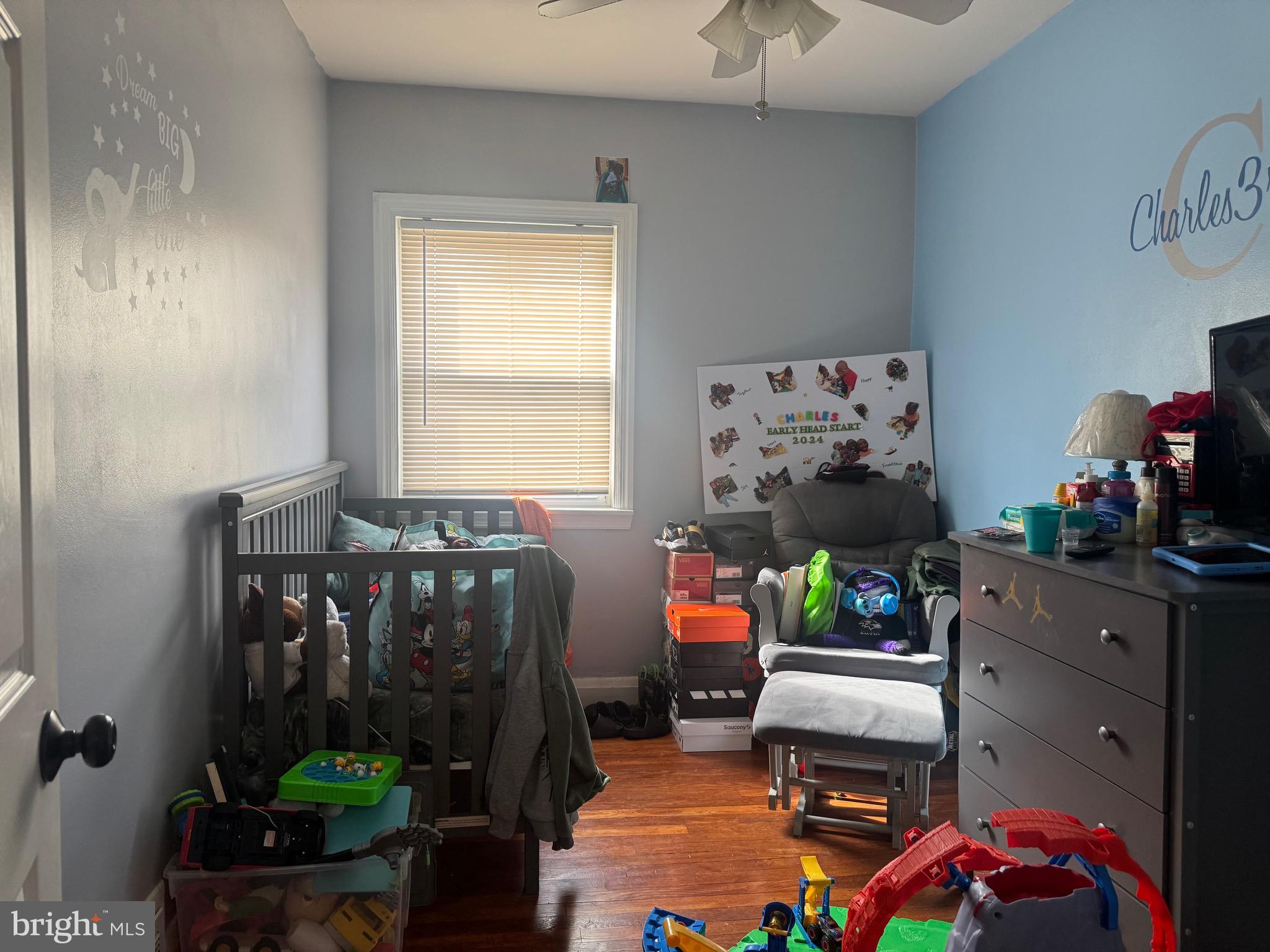 1653 Stonewood Road Baltimore, MD 21239 - Photo 13 of 17 a living room with furniture and a window