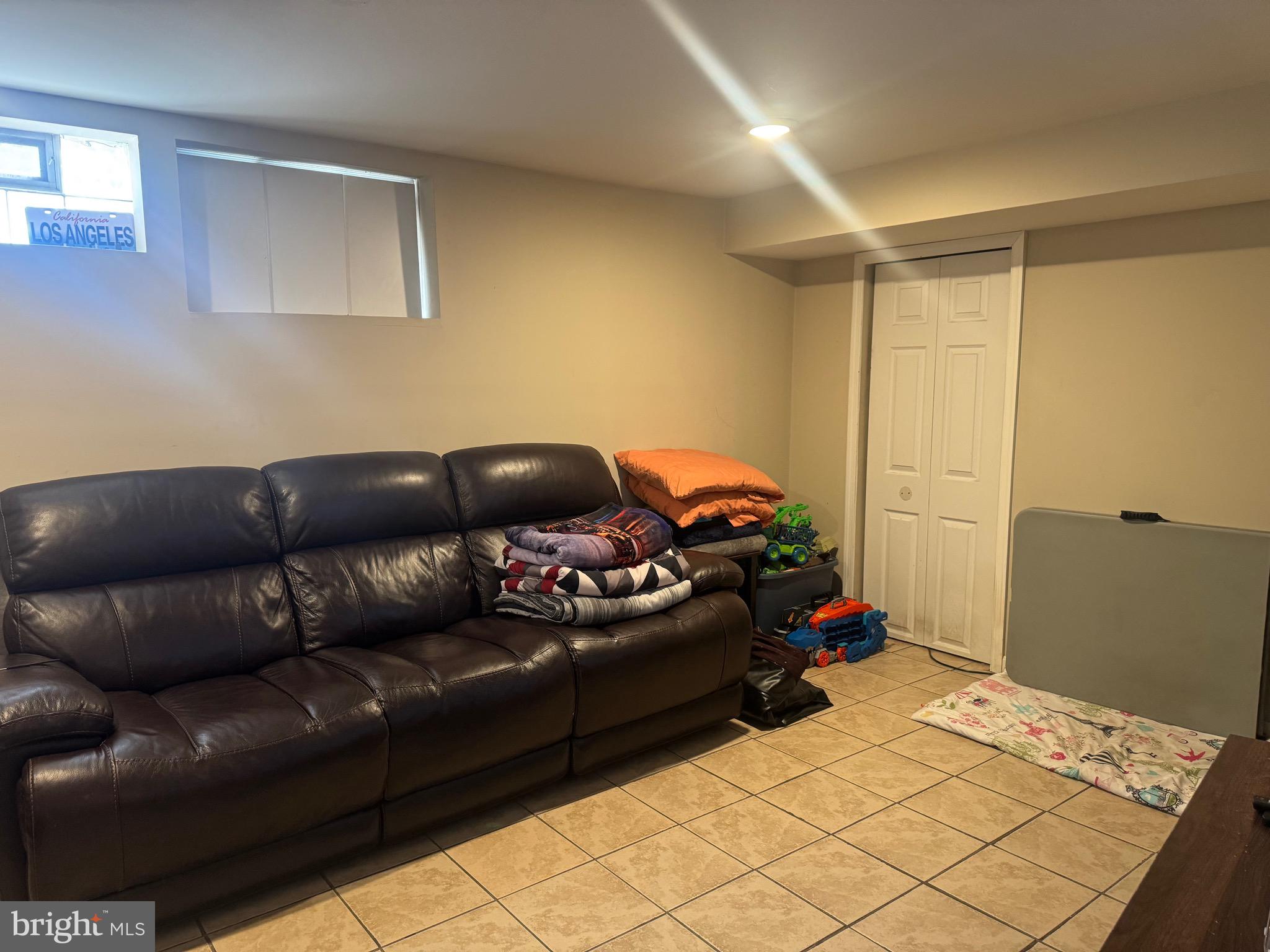 1653 Stonewood Road Baltimore, MD 21239 - Photo 15 of 17 a living room with furniture and a couch