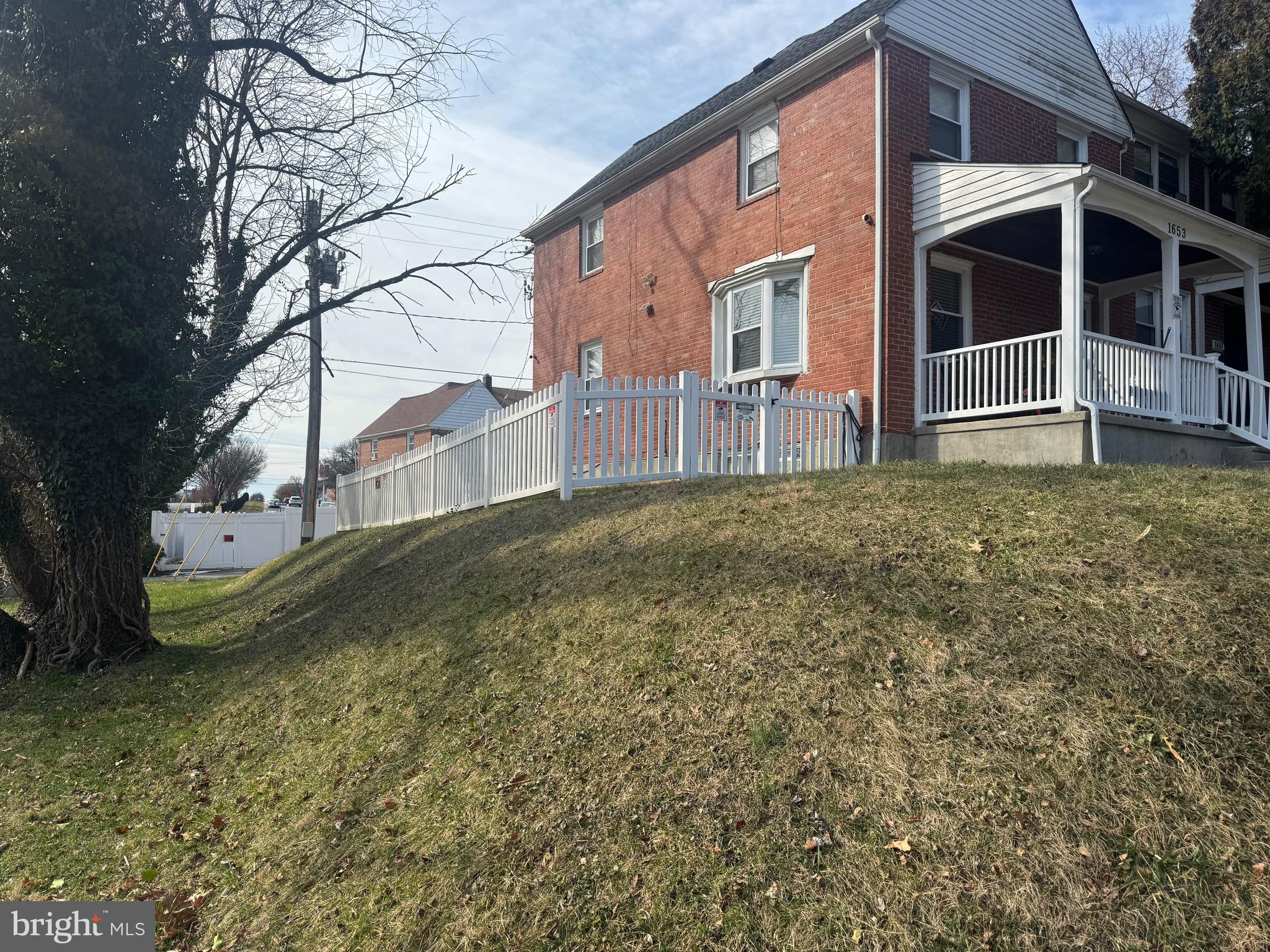 1653 Stonewood Road Baltimore, MD 21239 - Photo 2 of 17 a view of a house with a yard